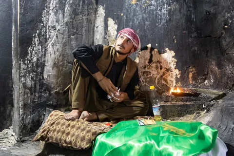 Yazidi man twisting lamp wicks at Lalish, Iraq (Kurdistan) — Nicolas Marincic
