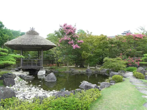 Thatched pavilion beside a garden pond, Japan — Nicolas Marincic
