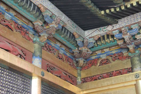 Carved and painted eaves of a shrine, Japan — Nicolas Marincic