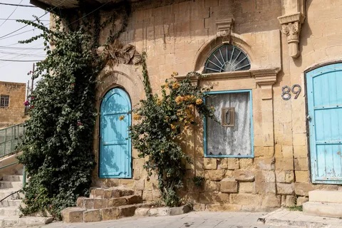 Blue doors and bougainvillea in Salt, Jordan — Nicolas Marincic