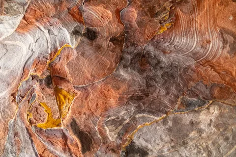 Swirling multicoloured sandstone ceiling, Petra, Jordan — Nicolas Marincic