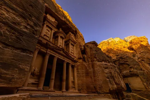 The Treasury lit at dusk from the Siq, Petra, Jordan — Nicolas Marincic