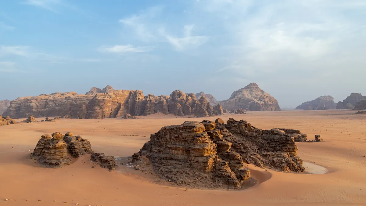 Sandstone inselbergs on the red sand of Wadi Rum, Jordan — Nicolas Marincic