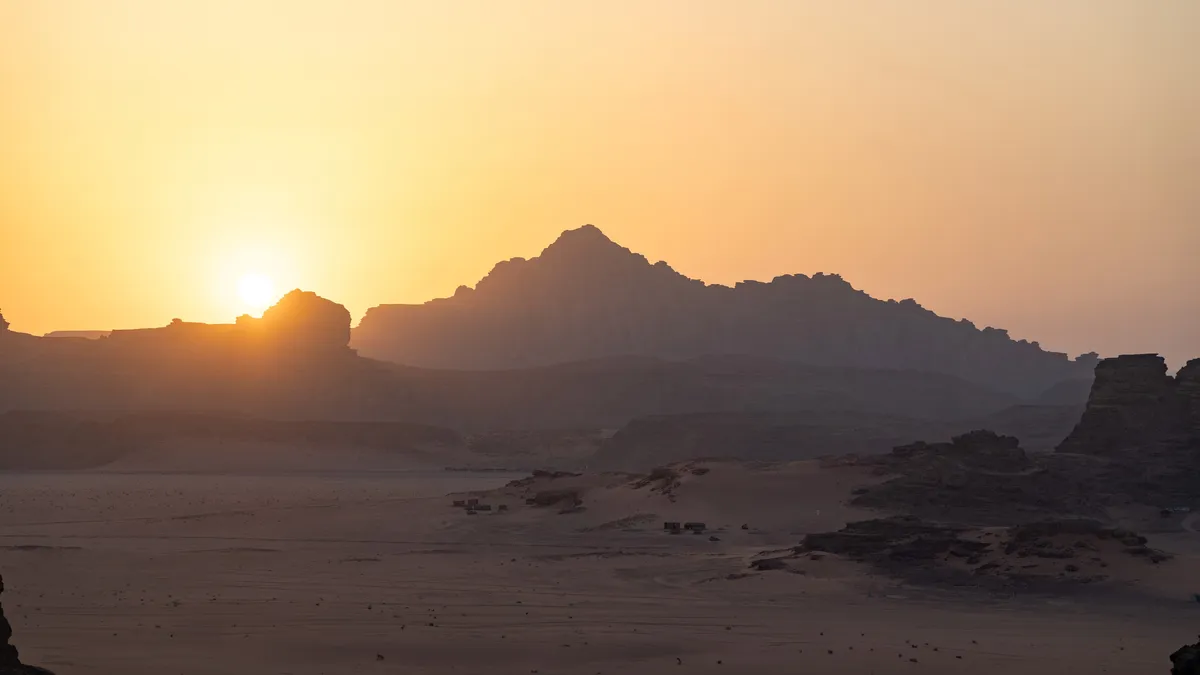 Sunset behind the jagged peaks of Wadi Rum, Jordan — Nicolas Marincic