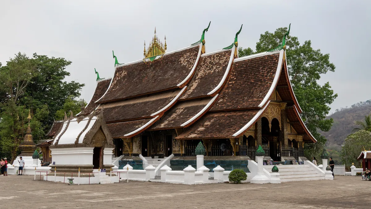 Sweeping roofs of Wat Xieng Thong, Luang Prabang, Laos — Nicolas Marincic
