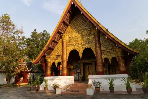 Gilded temple façade at golden hour, Luang Prabang, Laos — Nicolas Marincic