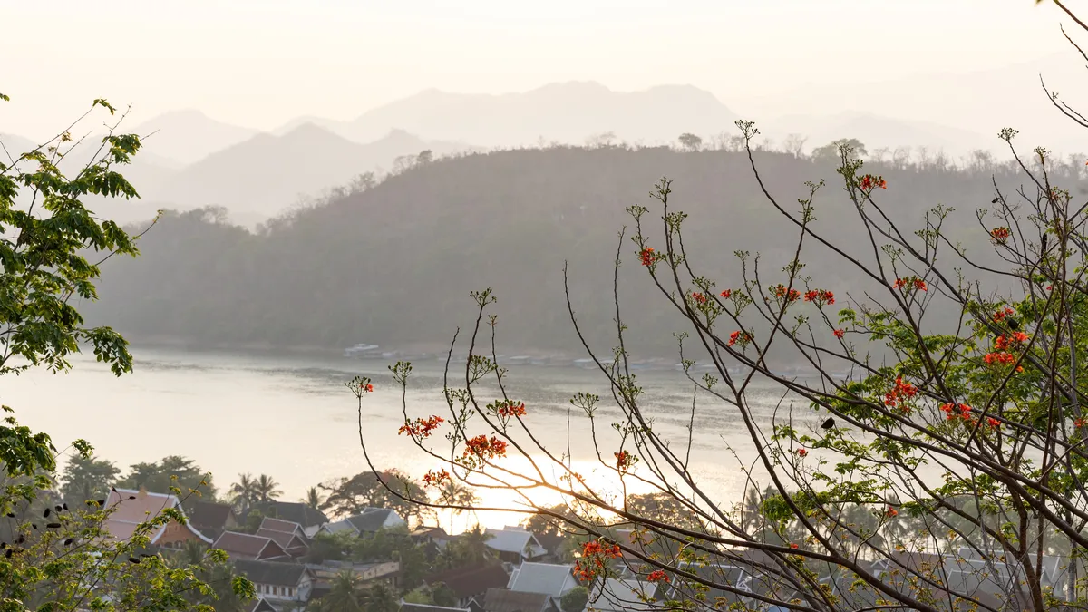 Hazy sunset over the Mekong from Mount Phousi, Laos — Nicolas Marincic