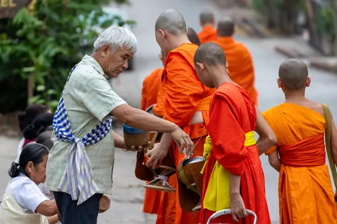 Morning alms offering to the monks, Laos — Nicolas Marincic