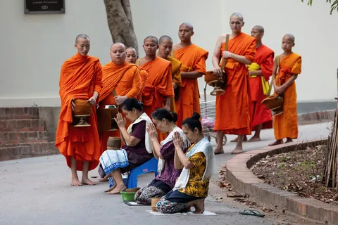 Monks’ procession for the alms round, Laos — Nicolas Marincic