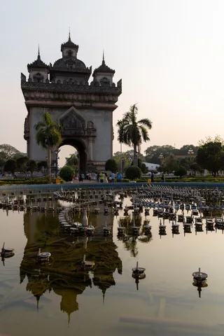 Patuxai reflected in Vientiane, Laos — Nicolas Marincic