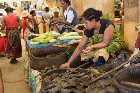 Vegetable seller at Hell-Ville market, Nosy Be, Madagascar — Nicolas Marincic