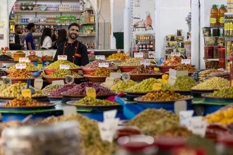 Olive seller in the souk, Morocco — Nicolas Marincic