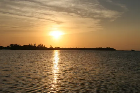 Sunset over the sea, Caye Caulker, Belize — Nicolas Marincic