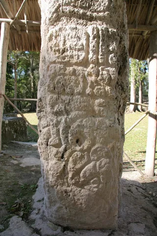 Carved Maya stela under a shelter, Guatemala — Nicolas Marincic