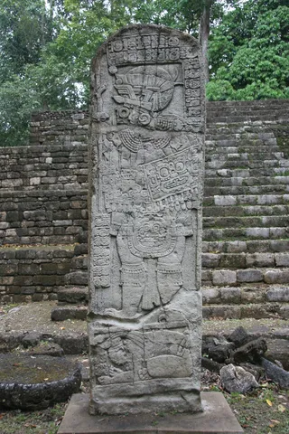 Stela before a pyramid, Aguateca, Guatemala — Nicolas Marincic