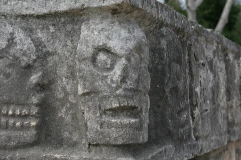 Carved skulls of the tzompantli at Chichén Itzá, Mexico — Nicolas Marincic