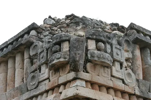 Chaac masks on a corner at Sayil, Mexico — Nicolas Marincic