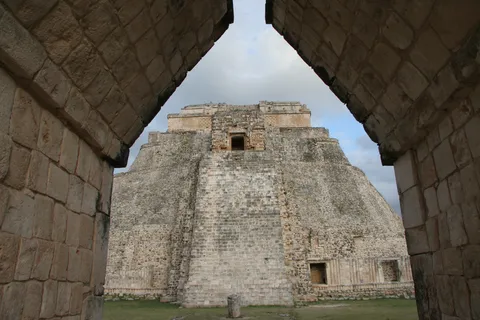 Pyramid of the Magician through the Nunnery arch, Uxmal, Mexico — Nicolas Marincic