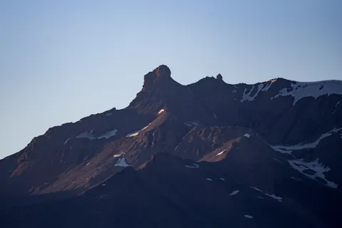 Jagged peak silhouetted at dusk, France — Nicolas Marincic