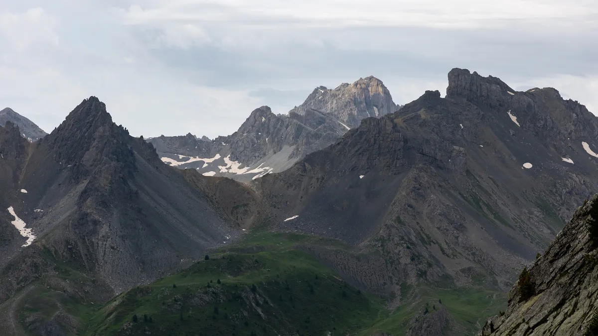 Jagged peaks under a heavy sky — Nicolas Marincic