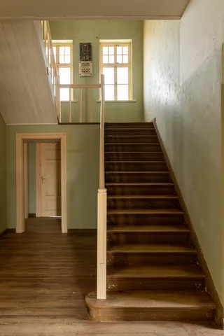 Staircase in a pastel villa, Kolmanskop, Namibia — Nicolas Marincic