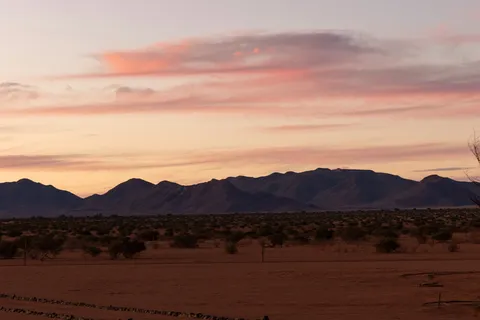 Pink clouds over the Tiras Mountains at dusk, Namibia — Nicolas Marincic
