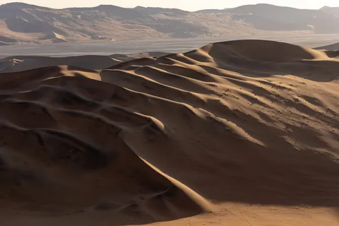 Dune ripples in raking light, Sossusvlei, Namibia — Nicolas Marincic