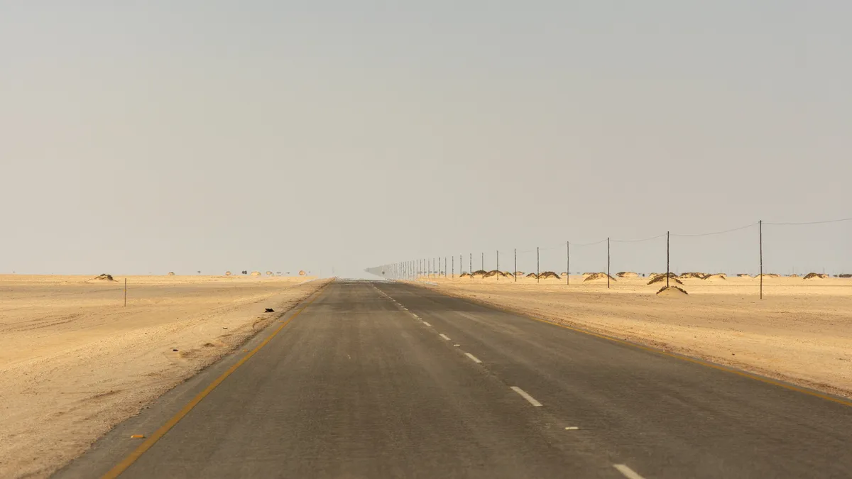 Straight road through the coastal desert, Namibia — Nicolas Marincic