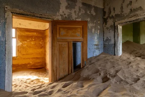 Room engulfed by sand at Kolmanskop, Namibia — Nicolas Marincic