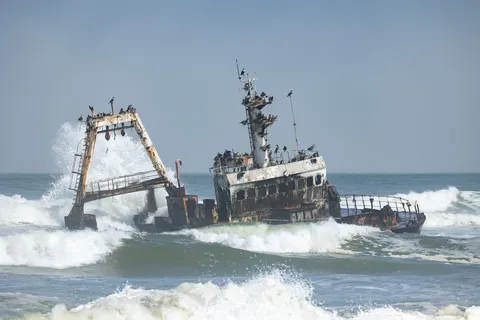 Wave-battered wreck on the Skeleton Coast, Namibia — Nicolas Marincic