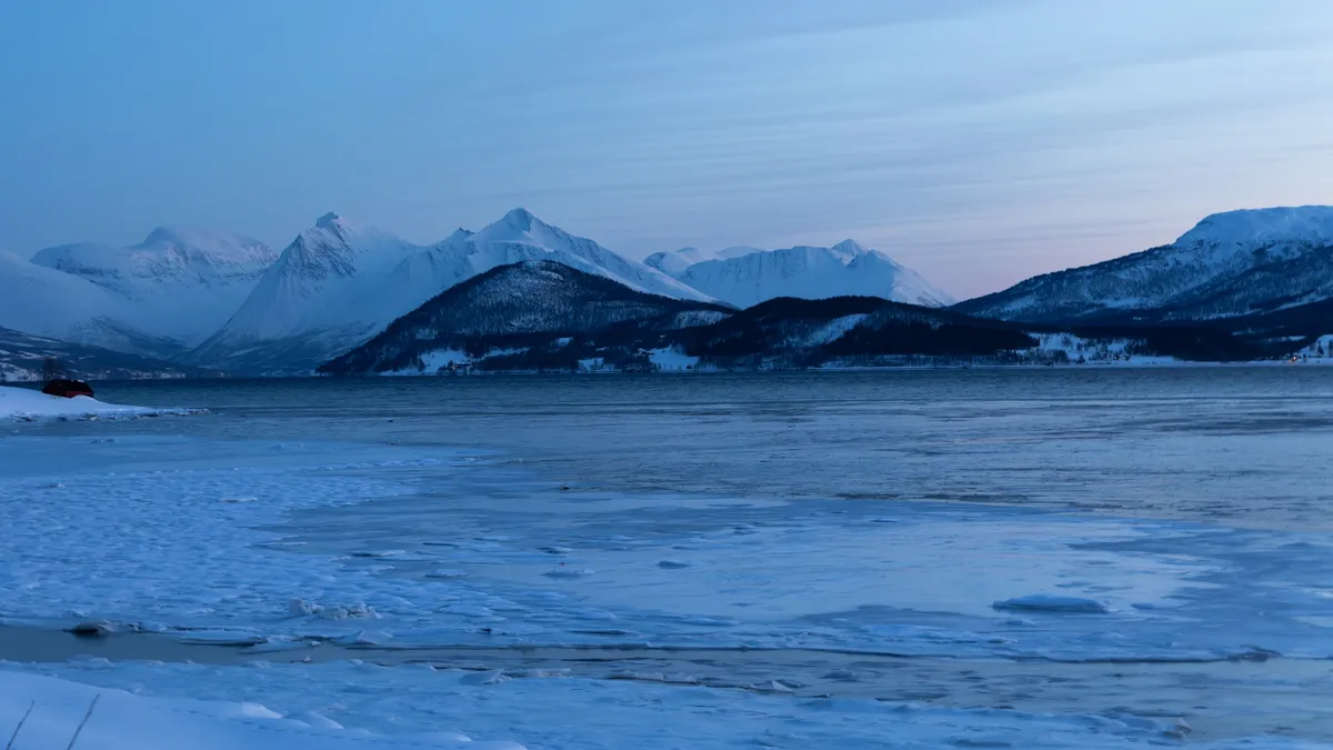 Blue hour over a frozen fjord, Troms, Norway — Nicolas Marincic