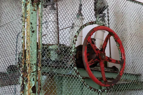 Red valve wheel, abandoned power station, Norway — Nicolas Marincic