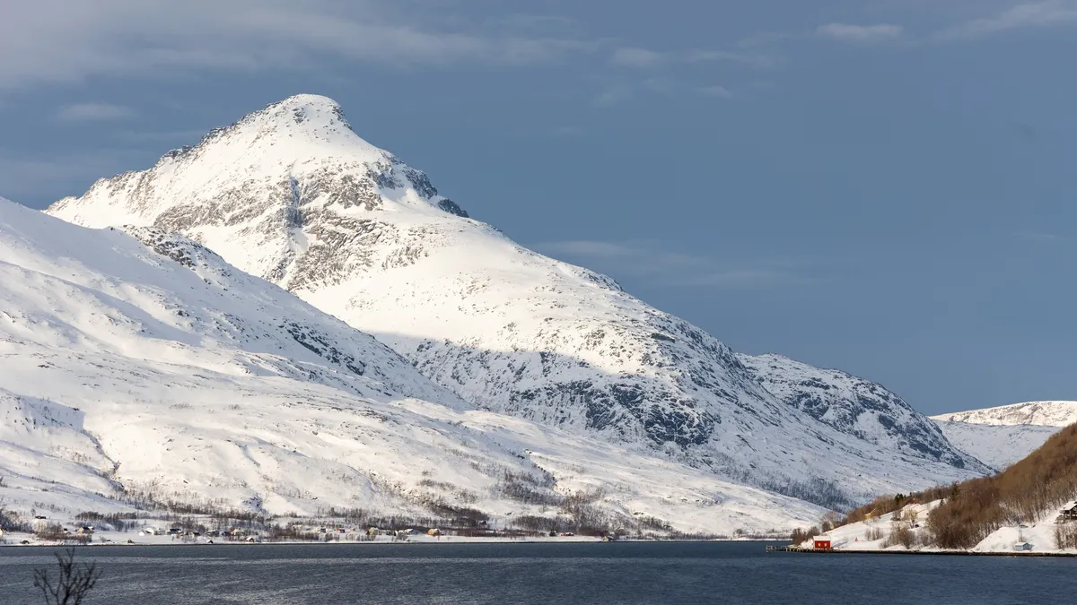 Snow-capped peak above the fjord, Norway — Nicolas Marincic