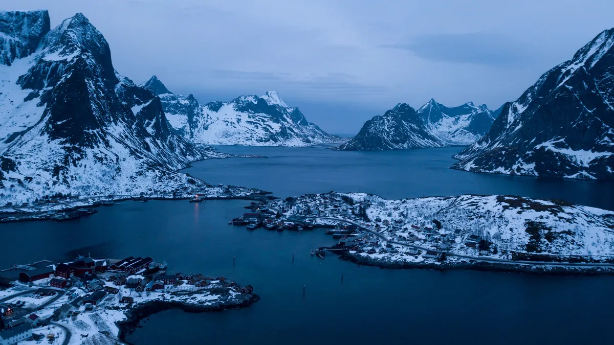 Islets and snowy peaks from above, Norway — Nicolas Marincic