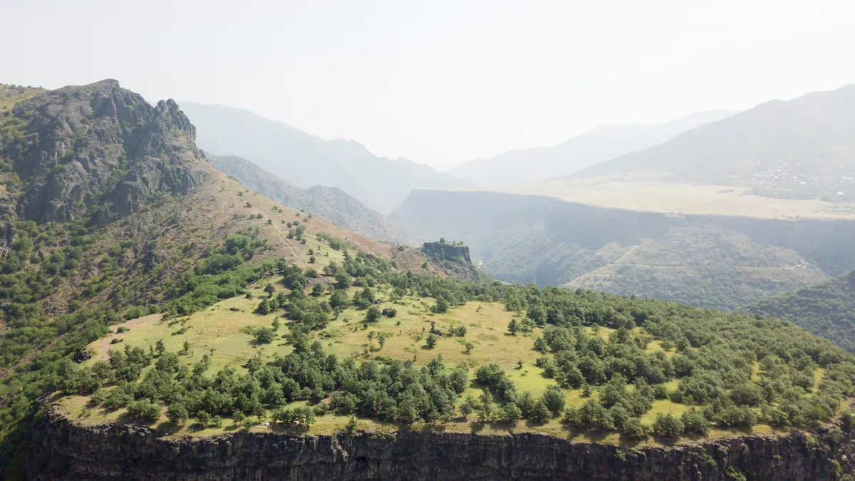 Green mountains in the haze, Uzbekistan — Nicolas Marincic