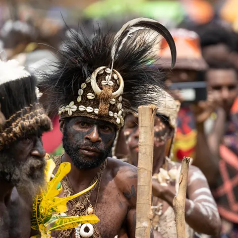 Man with shell crown and cassowary feathers, Papua — Nicolas Marincic