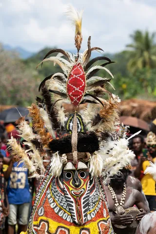Towering feathered mask costume, Papua — Nicolas Marincic
