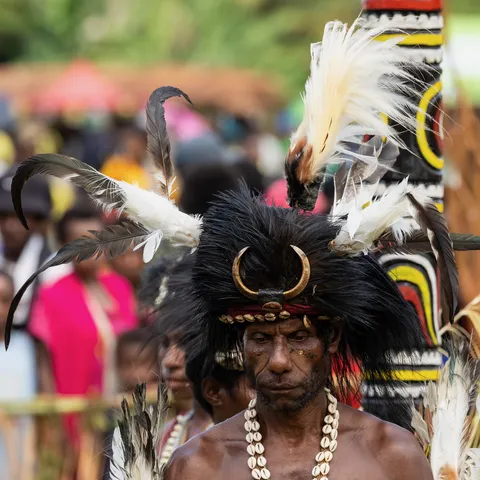 Elder with hornbill-beak and cassowary headdress, Papua — Nicolas Marincic