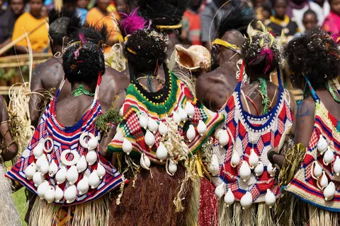 Women with cowrie-covered backs, Crocodile Festival, Papua — Nicolas Marincic