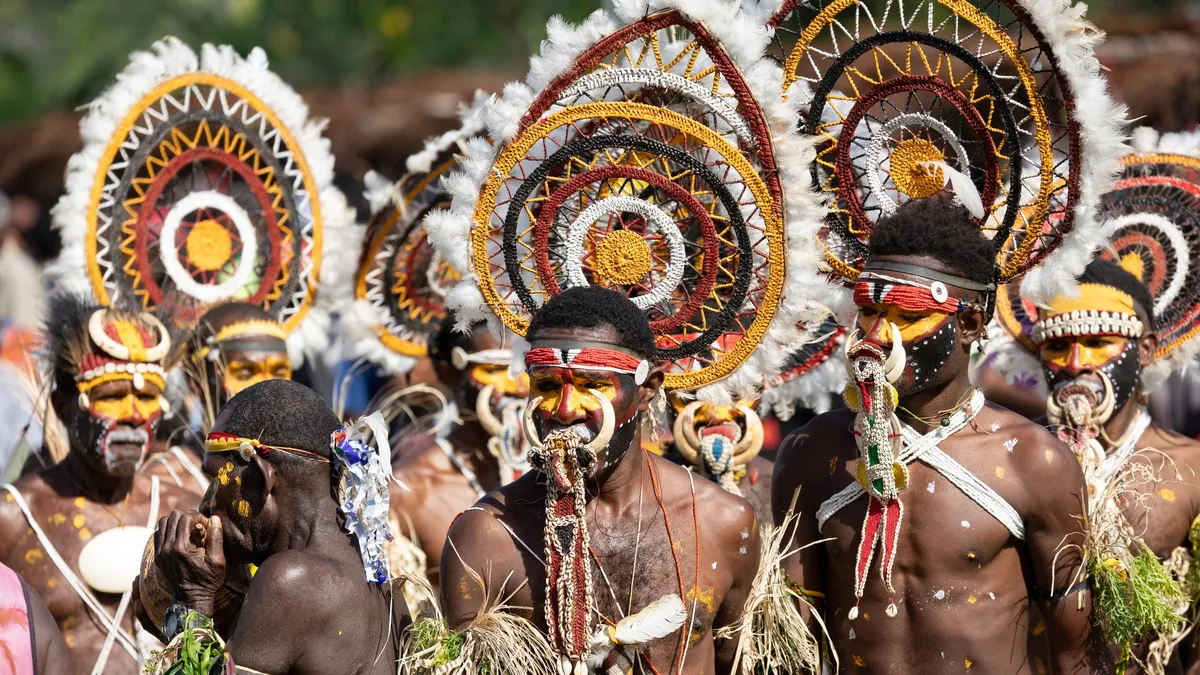 Dancers with round woven headdresses, Papua — Nicolas Marincic