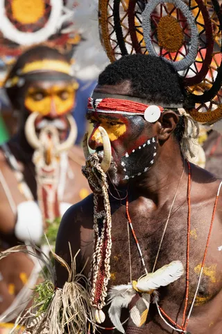 Yellow-painted face with nose ornament, Papua — Nicolas Marincic