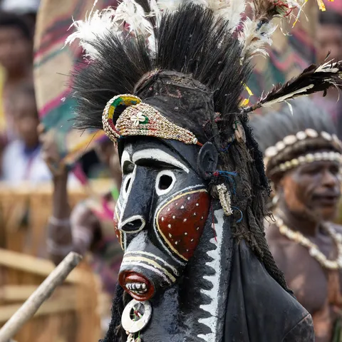 Close-up of a black and red carved mask, Papua — Nicolas Marincic