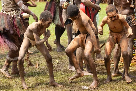 Clay-covered boys dancing, Crocodile Festival, Papua — Nicolas Marincic