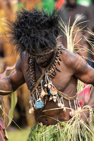 Dancer in shell and tooth necklaces, Papua — Nicolas Marincic