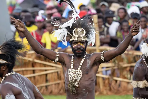 Dancer with arms raised, Crocodile Festival, Papua — Nicolas Marincic