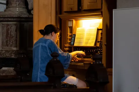 Organist playing in a baroque church, Ljubljana, Slovenia — Nicolas Marincic