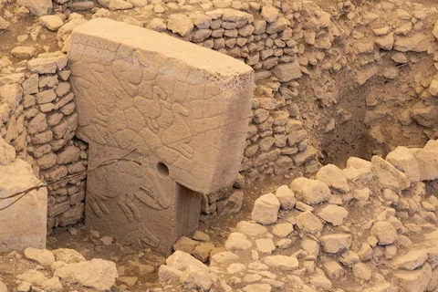 Carved pillar at Göbekli Tepe, Turkey — Nicolas Marincic