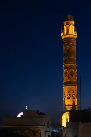 Illuminated Ulu Camii minaret at night, Mardin, Turkey — Nicolas Marincic