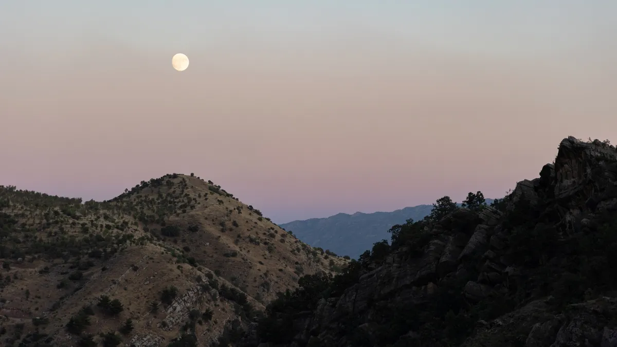 Moon over the mountains at dusk, Iraq (Kurdistan) — Nicolas Marincic