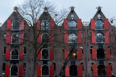 Warehouses with red shutters and bell gables, Amsterdam, Netherlands — Nicolas Marincic